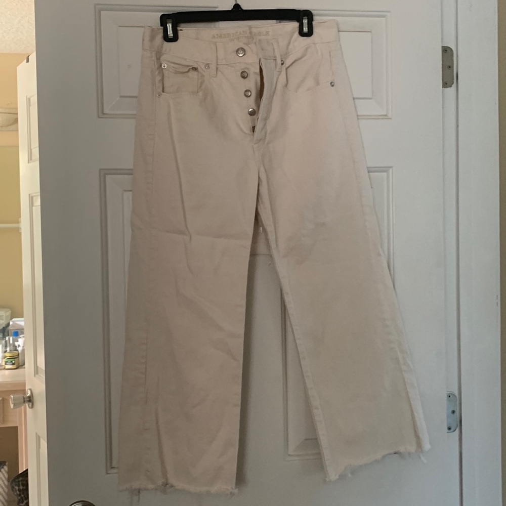 High waisted Cream wide legged ankle jeans with natural fraying